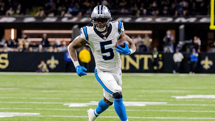 Dec 14, 2025; New Orleans, Louisiana, USA; Carolina Panthers running back Rico Dowdle (5) runs with the ball against the New Orleans Saints during the second quarter at Caesars Superdome. Mandatory Credit: Stephen Lew-Imagn Images