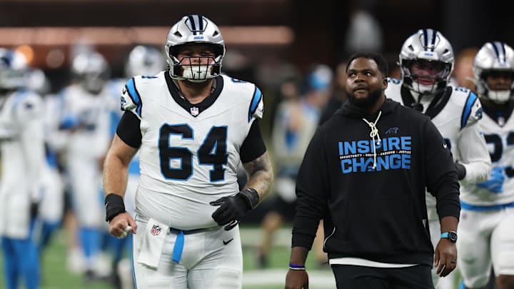 Dec 14, 2025; New Orleans, Louisiana, USA; Carolina Panthers center Cade Mays (64) runs on the field before the game against the New Orleans Saints at Caesars Superdome. Mandatory Credit: Stephen Lew-Imagn Images