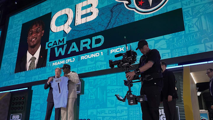 Quarterback Cam Ward from Miami poses with NFL Commissioner Roger Goodell after being selected 1st overall by the Tennessee Titans during the first round of the 2025 NFL Draft at Lambeau Field on April 24, 2025 in Green Bay, Wisconsin.