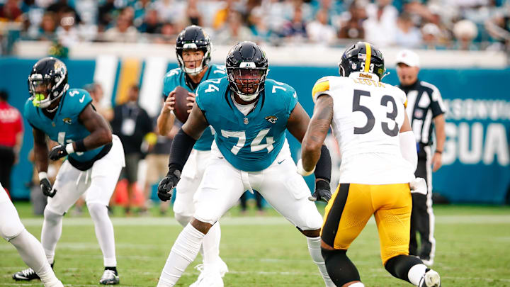 Aug 9, 2025; Jacksonville, Florida, USA; Jacksonville Jaguars offensive tackle Fred Johnson (74) prepares to block a rusher against the Pittsburgh Steelers during a preseason game at EverBank Stadium. 