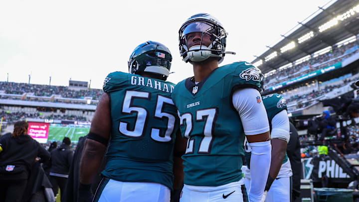 Dec 14, 2025; Philadelphia, Pennsylvania, USA; Philadelphia Eagles cornerback Quinyon Mitchell (27) and defensive end Brandon Graham (55) on the sidelines during the second quarter against the Las Vegas Raiders at Lincoln Financial Field. Mandatory Credit: Bill Streicher-Imagn Images