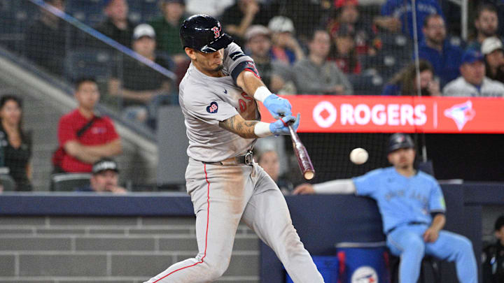 Boston Red Sox second baseman Vaughn Grissom (5) hits an RBI single against the Toronto Blue Jays in the tenth inning at Rogers Centre on Sept 24.