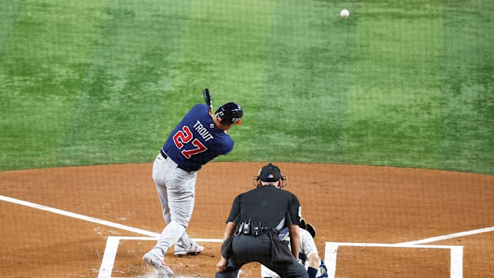 Mar 21, 2023; Miami, Florida, USA; USA center fielder Mike Trout (27) doubles against Japan in the first inning at LoanDepot Park. Mandatory Credit: Rhona Wise-Imagn Images