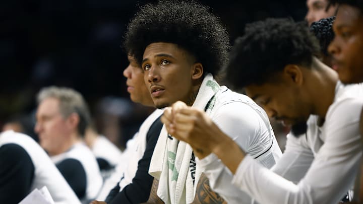 Feb 11, 2025; Orlando, Florida, USA;  Central Florida Knights guard Mikey Williams (1) sits on the bench in the game against the Iowa State Cyclones at Addition Financial Arena. Mandatory Credit: Russell Lansford-Imagn Images