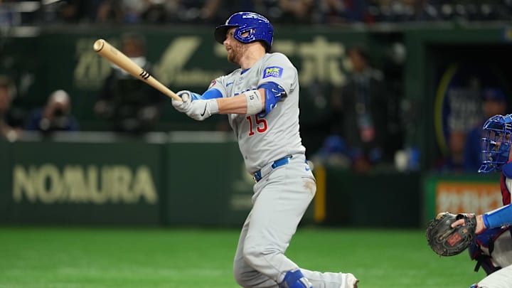 Mar 19, 2025; Bunkyo, Tokyo, JPN; Chicago Cubs catcher Carson Kelly (15) hits a single in the eighth inning against the Los Angeles Dodgers during the Tokyo Series at Tokyo Dome. 