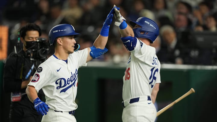 Mar 19, 2025; Bunkyo, Tokyo, JPN; Los Angeles Dodgers center fielder Tommy Edman (25) celebrates with catch Will Smith (16) (Right) after hitting a home run in the third inning against the Chicago Cubs during the Tokyo Series at Tokyo Dome. Mandatory Credit: Darren Yamashita-Imagn Images