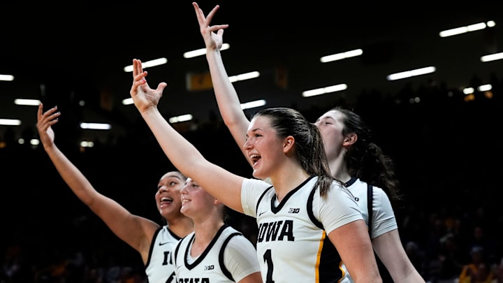 Iowa forward Hannah Stuelke (45), Iowa guard Taylor McCabe (2), Iowa guard Taylor Stremlow (1) and Iowa center Ava Heiden (5) react Nov. 26, 2025 at Carver-Hawkeye Arena in Iowa City, Iowa.