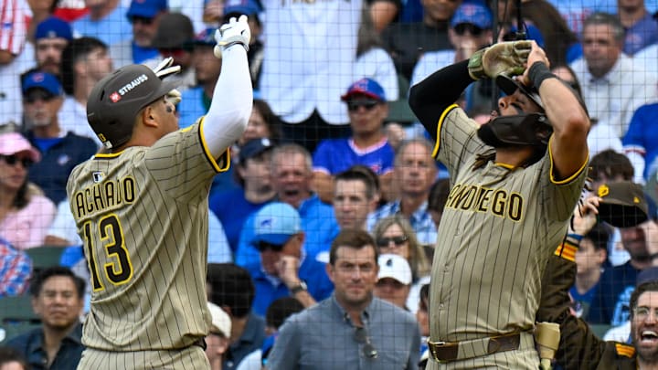 Oct 1, 2025; Chicago, Illinois, USA; San Diego infielder Manny Machado (13) and Fernando Tatis Jr. (13) (right) celebrate at home plate after hitting a two-run home run in the fifth inning against the Chicago Cubs during game two of the Wildcard round for the 2025 MLB playoffs at Wrigley Field. Oct 1, 2025; Chicago, Illinois, USA; San Diego infielder Manny Machado (13) and Fernando Tatis Jr. (13) (right) celebrate at home plate after hitting a two-run home run in the fifth inning against the Chicago Cubs during game two of the Wildcard round for the 2025 MLB playoffs at Wrigley Field.