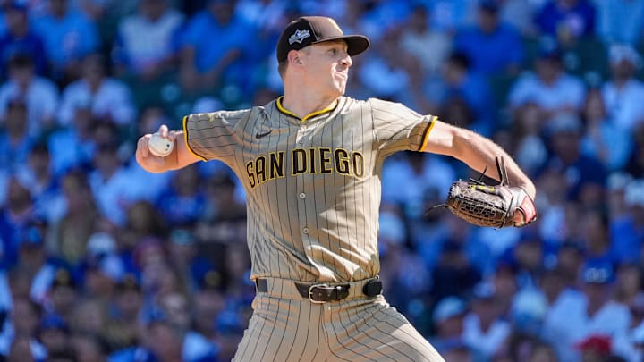Sep 30, 2025; Chicago, Illinois, USA; San Diego Padres starting pitcher Nick Pivetta (27) delivers a pitch against the Chicago Cubs in the first inning during game one of the Wildcard round for the 2025 MLB playoffs at Wrigley Field. 