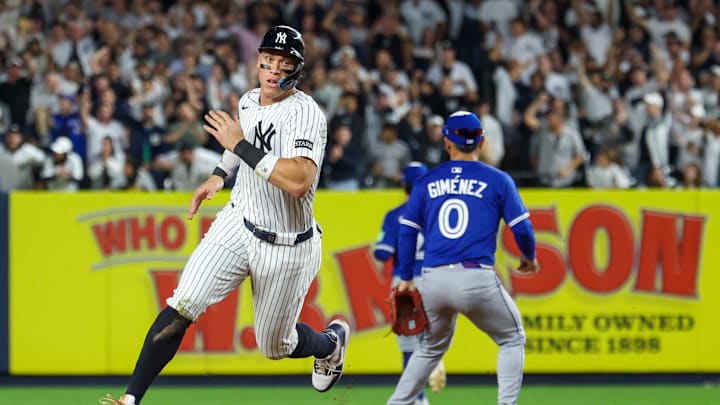 Oct 7, 2025; Bronx, New York, USA; New York Yankees outfielder Aaron Judge (99) rounds the bases after a double hit by Cody Bellinger (35) (not pictured) in the sixth inning against the Toronto Blue Jays during game three of the ALDS round for the 2025 MLB playoffs at Yankee Stadium. Mandatory Credit: Vincent Carchietta-Imagn Images