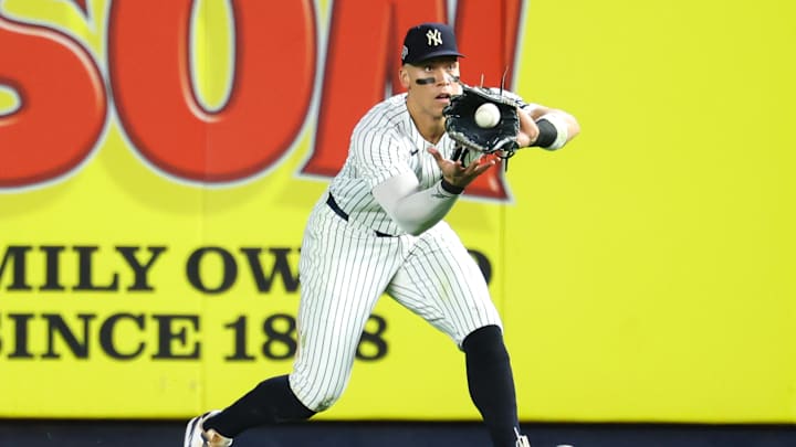 Oct 7, 2025; Bronx, New York, USA; New York Yankees outfielder Aaron Judge (99) makes a catch for an out against the Toronto Blue Jays in the fifth inning during game three of the ALDS round for the 2025 MLB playoffs at Yankee Stadium. Mandatory Credit: Vincent Carchietta-Imagn Images