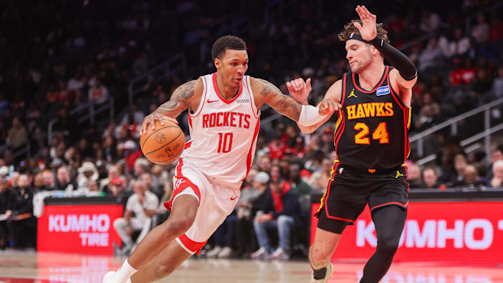 Jan 29, 2026; Atlanta, Georgia, USA; Houston Rockets forward Jabari Smith Jr. (10) drives on Atlanta Hawks forward Corey Kispert (24) in the fourth quarter at State Farm Arena. Mandatory Credit: Brett Davis-Imagn Images