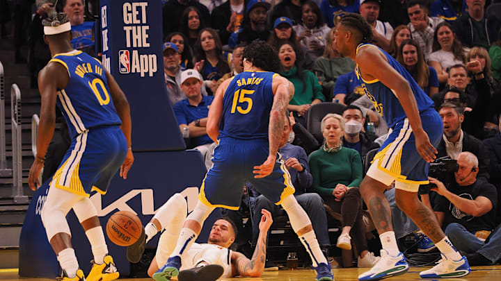 Mar 17, 2025; San Francisco, California, USA;  Denver Nuggets forward Michael Porter Jr. (1) on the floor after Golden State Warriors forward Gui Santos (15) blocked his shot during the first quarter at Chase Center. Mandatory Credit: Kelley L Cox-Imagn Images