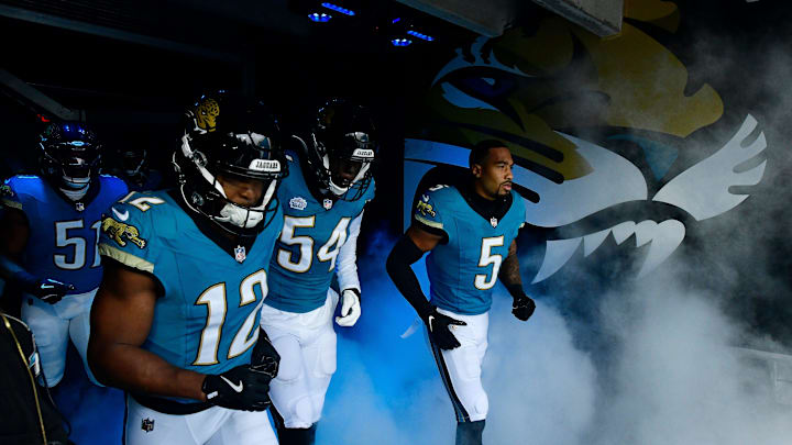 From left, Jacksonville Jaguars linebacker Ventrell Miller (51), wide receiver Devin Duvernay (12), defensive end DJ Coleman (54) and safety Andre Cisco (5) run on the field before an NFL football matchup Sunday, Dec. 15, 2024 at EverBank Stadium in Jacksonville, Fla. [Corey Perrine/Florida Times-Union]