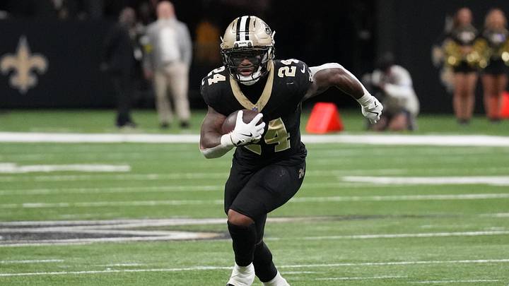 Former Kansas Jayhawks legendary running back Devin Neal (24) during a game with the New Orleans Saints Former Kansas Jayhawks legendary running back Devin Neal (24) during a game with the New Orleans Saints