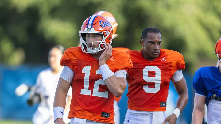 Florida quarterbacks Aaron Philo (12) and J. Tramell Jones Jr. (9) practice during Florida Football Fall camp availability at Heavener Football Training Center in Gainesville, FL on Friday, August 7, 2026. [Alan Youngblood/Gainesville Sun]
