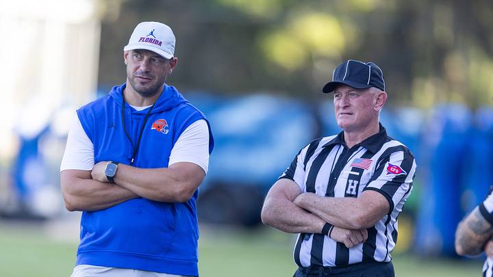 Florida Head Coach Jon Sumrall, left, watches practice with referees at Heavener Football Complex in Gainesville, FL on Tuesday, August 11, 2026. [Alan Youngblood/Gainesville Sun]