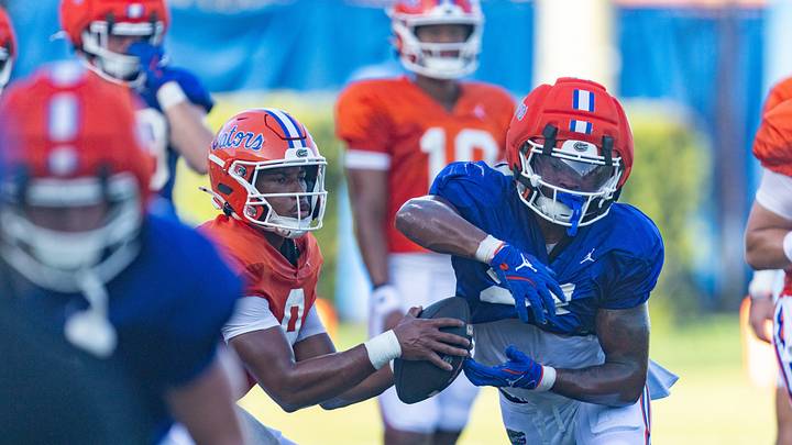 Florida quarterback J. Tramell Jones Jr. (9) hands off  to Florida running back Evan Pryor (21) at Heavener Football Complex in Gainesville, FL on Tuesday, August 11, 2026. [Alan Youngblood/Gainesville Sun]