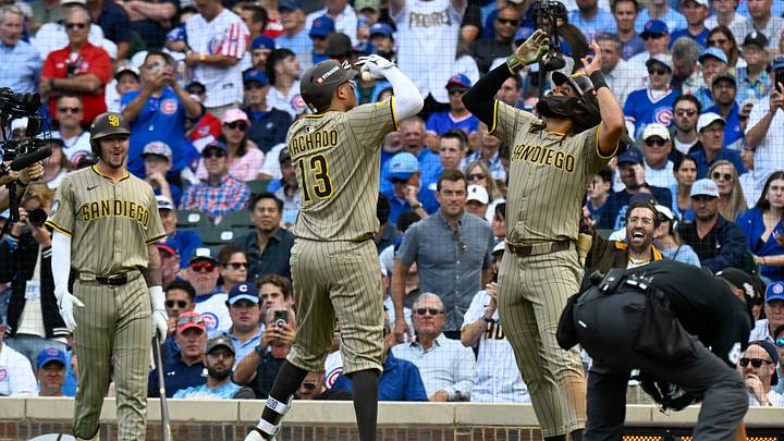 Oct 1, 2025; Chicago, Illinois, USA; San Diego infielder Manny Machado (13) and Fernando Tatis Jr. (13) (right) celebrate at home plate after hitting a two-run home run in the fifth inning against the Chicago Cubs during game two of the Wildcard round for the 2025 MLB playoffs at Wrigley Field. Mandatory Credit: Matt Marton-Imagn Images Oct 1, 2025; Chicago, Illinois, USA; San Diego infielder Manny Machado (13) and Fernando Tatis Jr. (13) (right) celebrate at home plate after hitting a two-run home run in the fifth inning against the Chicago Cubs during game two of the Wildcard round for the 2025 MLB playoffs at Wrigley Field. Mandatory Credit: Matt Marton-Imagn Images