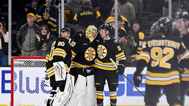 Feb 26, 2026; Boston, Massachusetts, USA; Boston Bruins goaltender Joonas Korpisalo (70) celebrates defeating the Columbus Blue Jackets with goaltender Michael DiPietro (80) and center Casey Mittelstadt (11) at TD Garden. Mandatory Credit: Eric Canha-Imagn Images