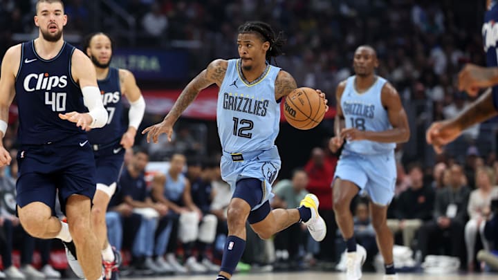 Dec 29, 2023; Los Angeles, California, USA;  Memphis Grizzlies guard Ja Morant (12) dribbles the ball during the first quarter against the Los Angeles Clippers at Crypto.com Arena. Mandatory Credit: Kiyoshi Mio-Imagn Images