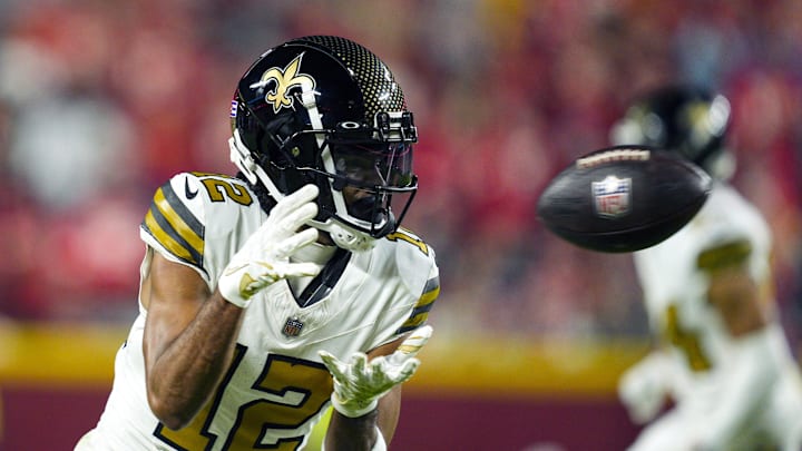 Oct 7, 2024; Kansas City, Missouri, USA; New Orleans Saints wide receiver Chris Olave (12) catches a pass during the second half against the Kansas City Chiefs at GEHA Field at Arrowhead Stadium. Mandatory Credit: Jay Biggerstaff-Imagn Images
