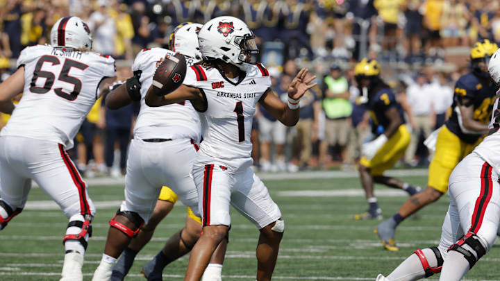 Sep 14, 2024; Ann Arbor, Michigan, USA;  Arkansas State Red Wolves quarterback Jaylen Raynor (1) throws against the Michigan Wolverines during the first half at Michigan Stadium. Mandatory Credit: Rick Osentoski-Imagn Images