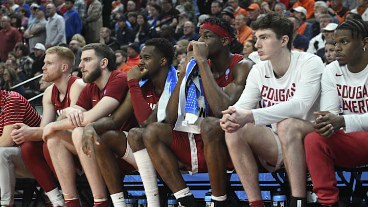 Mar 23, 2024; Omaha, NE, USA; Washington State Cougars guard Kymany Houinsou (31) and center Rueben Chinyelu (20) look on from the sidelines during the second half in the second round of the 2024 NCAA Tournament at CHI Health Center Omaha. Mandatory Credit: Steven Branscombe-Imagn Images