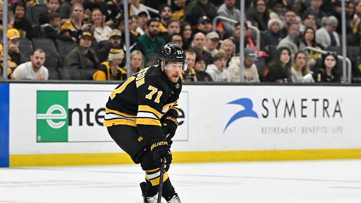 Sep 29, 2025; Boston, Massachusetts, USA;  Boston Bruins left wing Viktor Arvidsson (71) plays the puck in the neutral zone during the first period against the Philadelphia Flyers at TD Garden. Mandatory Credit: Eric Canha-Imagn Images