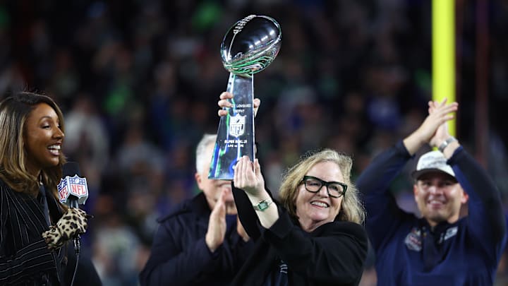 Feb 8, 2026; Santa Clara, CA, USA; Seattle Seahawks chairman Jody Allen celebrates with the Vince Lombardi trophy on the podium after defeating the New England Patriots in Super Bowl LX at Levi's Stadium.