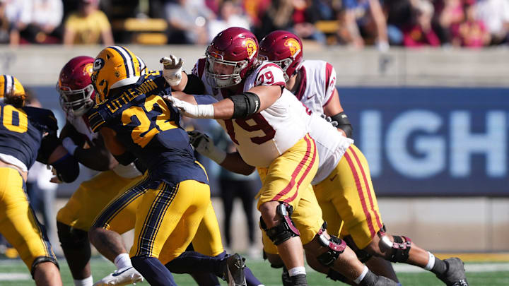 Oct 28, 2023; Berkeley, California, USA; USC Trojans offensive lineman Jonah Monheim (79) blocks California Golden Bears defensive back Matthew Littlejohn (22) during the second quarter at California Memorial Stadium. Mandatory Credit: Darren Yamashita-Imagn Images Oct 28, 2023; Berkeley, California, USA; USC Trojans offensive lineman Jonah Monheim (79) blocks California Golden Bears defensive back Matthew Littlejohn (22) during the second quarter at California Memorial Stadium. Mandatory Credit: Darren Yamashita-Imagn Images