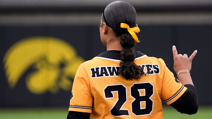 Iowa infielder Avery Jackson (28) signals two outs against Penn State April 21, 2025, at Pearl Field in Iowa City, Iowa.