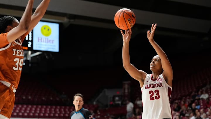 Mar 1, 2026; Tuscaloosa, AL, USA; Alabama guard Jessica Timmons (23) takes a three point shot against Texas forward Madison Booker (35) at Coleman Coliseum. Mandatory Credit: Gary Cosby Jr.-Tuscaloosa News