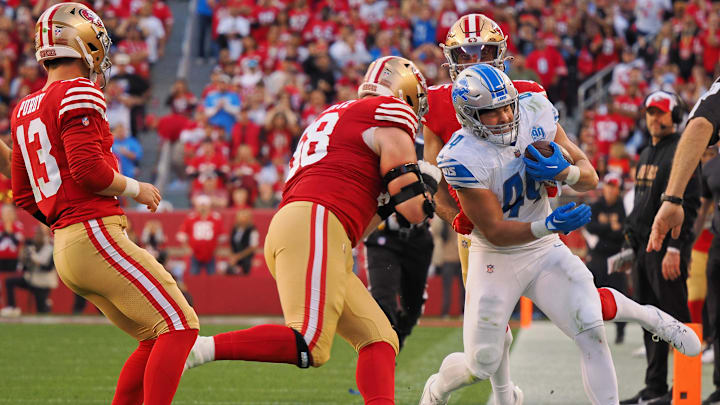 Jan 28, 2024; Santa Clara, California, USA; Detroit Lions linebacker Malcolm Rodriguez (44) is knocked out of bounds by San Francisco 49ers defensive end Alex Barrett (58) after making an interception during the first half of the NFC Championship football game at Levi's Stadium. Mandatory Credit: Kelley L Cox-Imagn Images