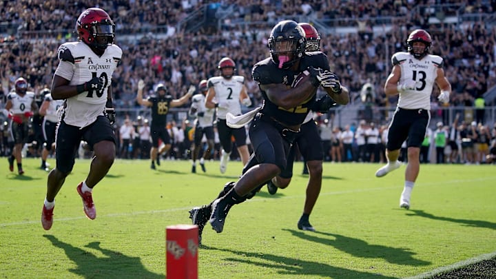 UCF Knights running back RJ Harvey (22) scores a touchdown in the first quarter during a college football game against the Cincinnati Bearcats, Saturday, Oct. 29, 2022, at FBC Mortgage Stadium in Orlando, Fla. The UCF Knights lead at halftime, 10-6.

Ncaaf Cincinnati Bearcats At Ucf Knights Oct 29 697