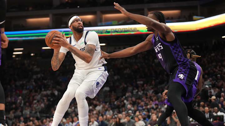 Jan 6, 2026; Sacramento, California, USA; Dallas Mavericks forward Anthony Davis (3) holds onto the ball next to Sacramento Kings forward Precious Achiuwa (9) in the second quarter at the Golden 1 Center. Mandatory Credit: Cary Edmondson-Imagn Images