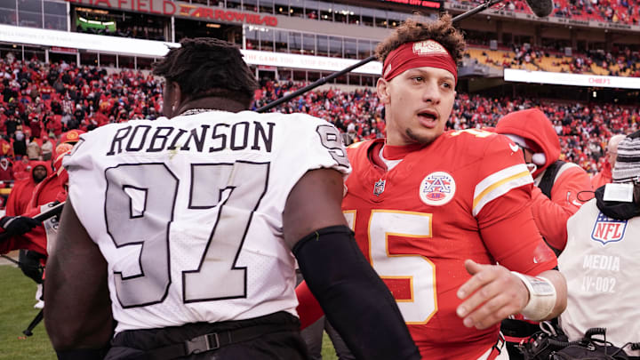 Dec 25, 2023; Kansas City, Missouri, USA; Kansas City Chiefs quarterback Patrick Mahomes (15) embraces Las Vegas Raiders defensive end Janarius Robinson (97) after the game at GEHA Field at Arrowhead Stadium. Mandatory Credit: Denny Medley-Imagn Images Dec 25, 2023; Kansas City, Missouri, USA; Kansas City Chiefs quarterback Patrick Mahomes (15) embraces Las Vegas Raiders defensive end Janarius Robinson (97) after the game at GEHA Field at Arrowhead Stadium. Mandatory Credit: Denny Medley-Imagn Images