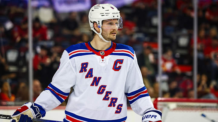 Nov 21, 2024; Calgary, Alberta, CAN; New York Rangers defenseman Jacob Trouba (8) against the Calgary Flames during the second period at Scotiabank Saddledome. Mandatory Credit: Sergei Belski-Imagn Images