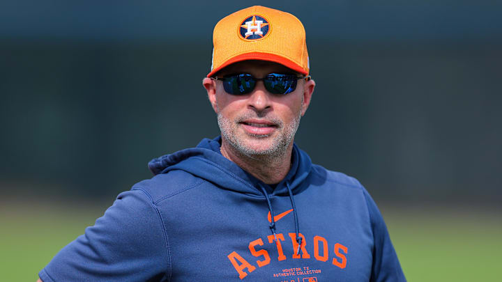 Feb 14, 2025; West Palm Beach, FL, USA; Houston Astros manager Joe Espada (19) looks on during a spring training workout at CACTI Park of the Palm Beaches