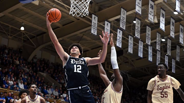 Feb 3, 2026; Durham, North Carolina, USA;  Duke Blue Devils forward Cameron Boozer (12) shoots in front of Boston College Eagles forward Jayden Hastings (22) during the second half at Cameron Indoor Stadium. Mandatory Credit: Rob Kinnan-Imagn Images
