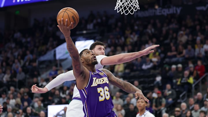 Dec 18, 2025; Salt Lake City, Utah, USA;  Los Angeles Lakers guard Marcus Smart (36) shoots against Utah Jazz center Jusuf Nurkic (30) during the first quarter at Delta Center. Mandatory Credit: Chris Nicoll-Imagn Images