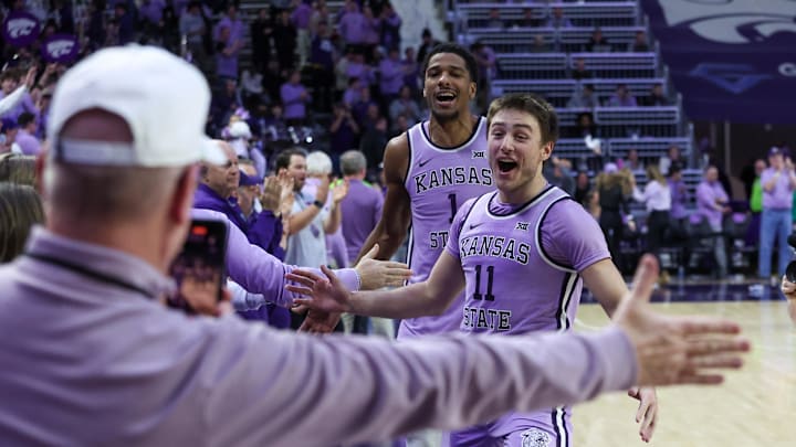 Feb 11, 2025; Manhattan, Kansas, USA; Kansas State Wildcats guard Brendan Hausen (11) and forward David N'Guessan (1) celebrate a win over the Arizona Wildcats at Bramlage Coliseum. Mandatory Credit: Scott Sewell-Imagn Images