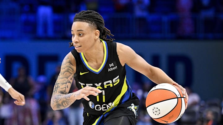 Jun 28, 2025; Arlington, Texas, USA; Dallas Wings guard JJ Quinerly (11) brings the ball up court against the Washington Mystics during the second half at College Park Center. Mandatory Credit: Jerome Miron-Imagn Images