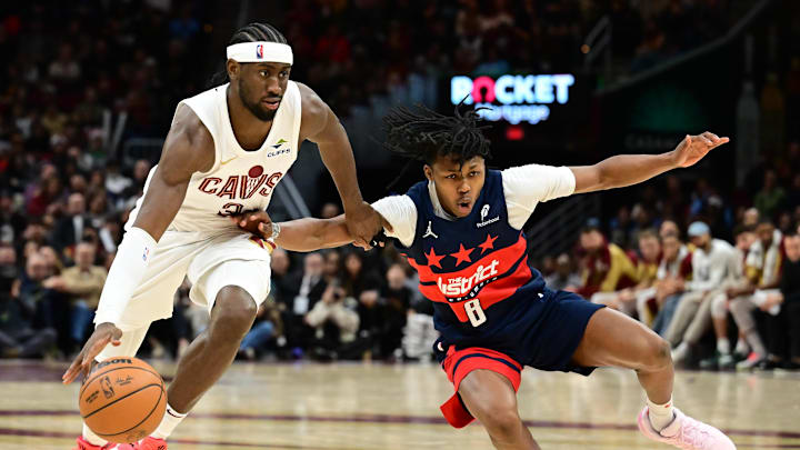 Dec 13, 2024; Cleveland, Ohio, USA; Cleveland Cavaliers guard Caris LeVert (3) drives to the basket against Washington Wizards guard Carlton Carrington (8) during the second half at Rocket Mortgage FieldHouse. Mandatory Credit: Ken Blaze-Imagn Images