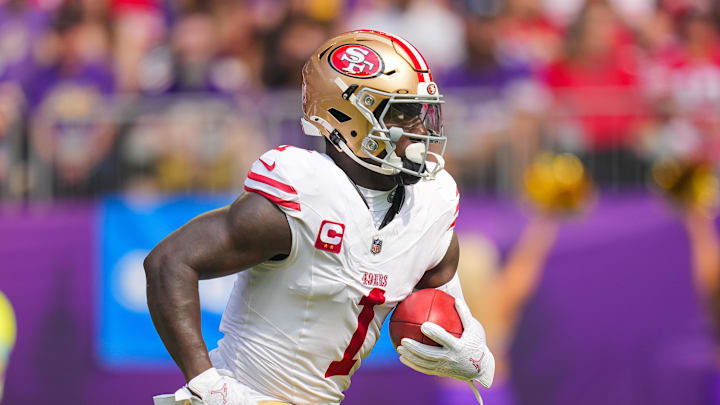 Sep 15, 2024; Minneapolis, Minnesota, USA; San Francisco 49ers wide receiver Deebo Samuel Sr. (1) runs back a kick against the Minnesota Vikings in the first quarter at U.S. Bank Stadium. Mandatory Credit: Brad Rempel-Imagn Images