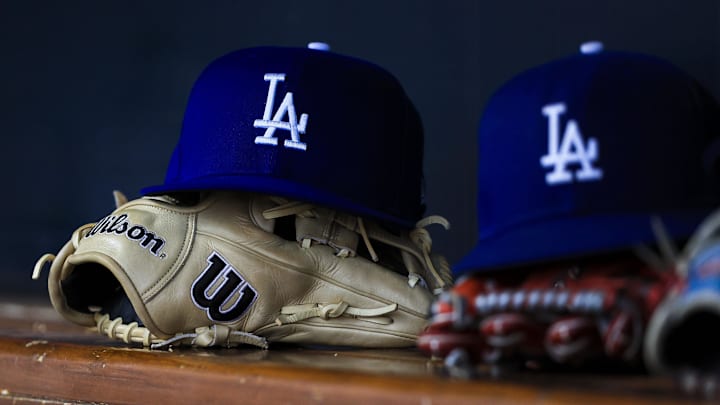 Jul 30, 2025; Cincinnati, Ohio, USA; A general view of a Los Angeles Dodgers hat and glove during the second inning in the game against the Cincinnati Reds at Great American Ball Park. Mandatory Credit: Katie Stratman-Imagn Images Jul 30, 2025; Cincinnati, Ohio, USA; A general view of a Los Angeles Dodgers hat and glove during the second inning in the game against the Cincinnati Reds at Great American Ball Park. Mandatory Credit: Katie Stratman-Imagn Images