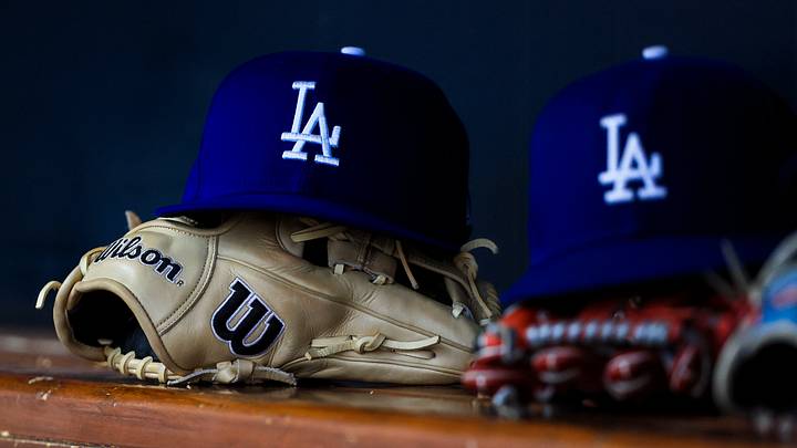 Jul 30, 2025; Cincinnati, Ohio, USA; A general view of a Los Angeles Dodgers hat and glove during the second inning in the game against the Cincinnati Reds at Great American Ball Park. Mandatory Credit: Katie Stratman-Imagn Images Jul 30, 2025; Cincinnati, Ohio, USA; A general view of a Los Angeles Dodgers hat and glove during the second inning in the game against the Cincinnati Reds at Great American Ball Park. Mandatory Credit: Katie Stratman-Imagn Images