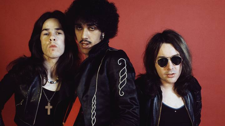 Thin Lizzy stand for a portrait photo