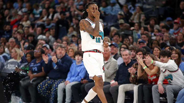 Dec 26, 2024; Memphis, Tennessee, USA; Memphis Grizzlies guard Ja Morant (12) reacts after a three point basket during the second quarter against the Toronto Raptors at FedExForum. Mandatory Credit: Petre Thomas-Imagn Images