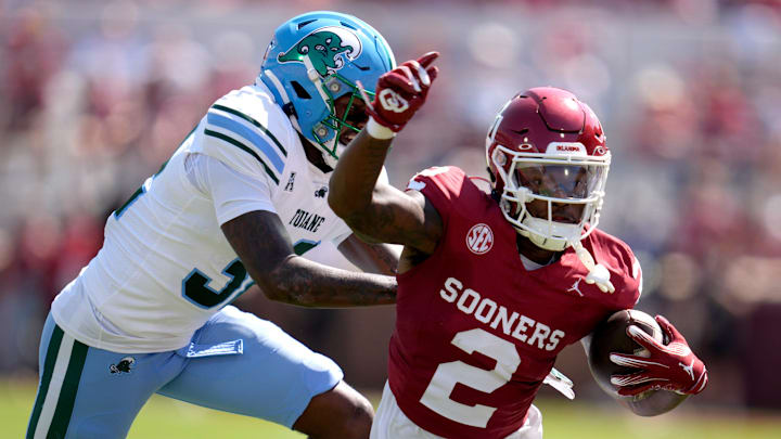 Oklahoma Sooners running back Jovantae Barnes (2) is pushed out by Tulane Green Wave defensive lineman Angelo Anderson (3)during a college football game between the University of Oklahoma Sooners (OU) and the Tulane Green Wave at Gaylord Family - Oklahoma Memorial Stadium in Norman, Okla., Saturday, Sept. 14, 2024.
